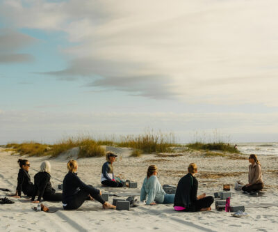 Non-golfing guests eased into the morning with beachside yoga led by expert instructor, Charlotte Hardwick